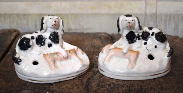 Pair of Staffordshire pottery dog quill holders