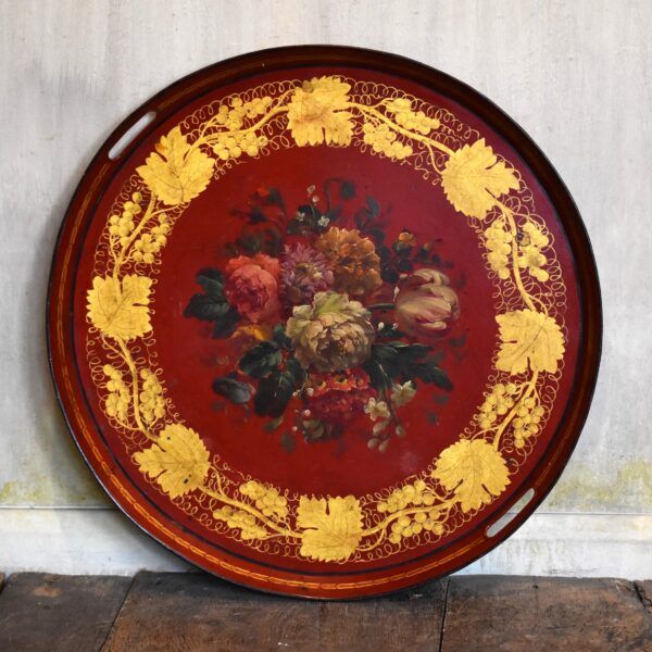 Red toleware tray painted with flowers