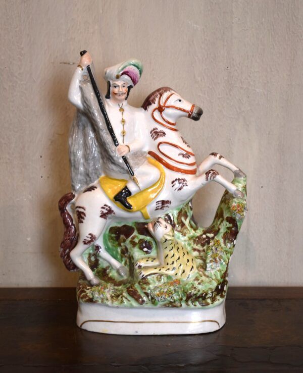 Rare Staffordshire figure of a leopard hunter