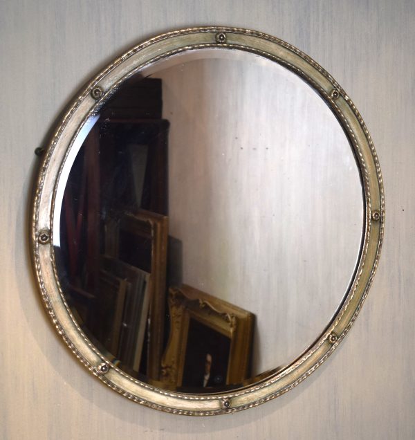 Silvered circular mirror