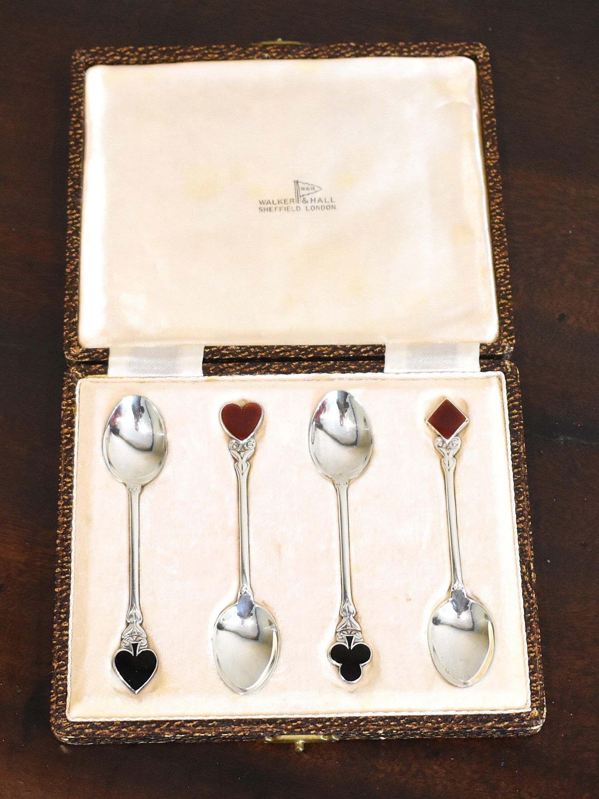 Set of four silver card suits spoons